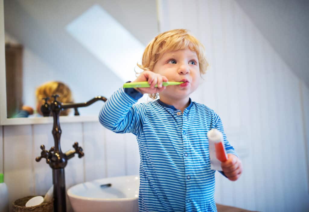 Little boy brushing his teeth 