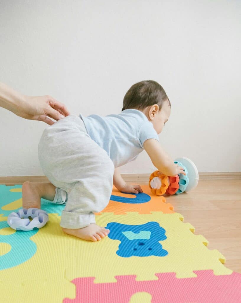 Baby crawling to the toy